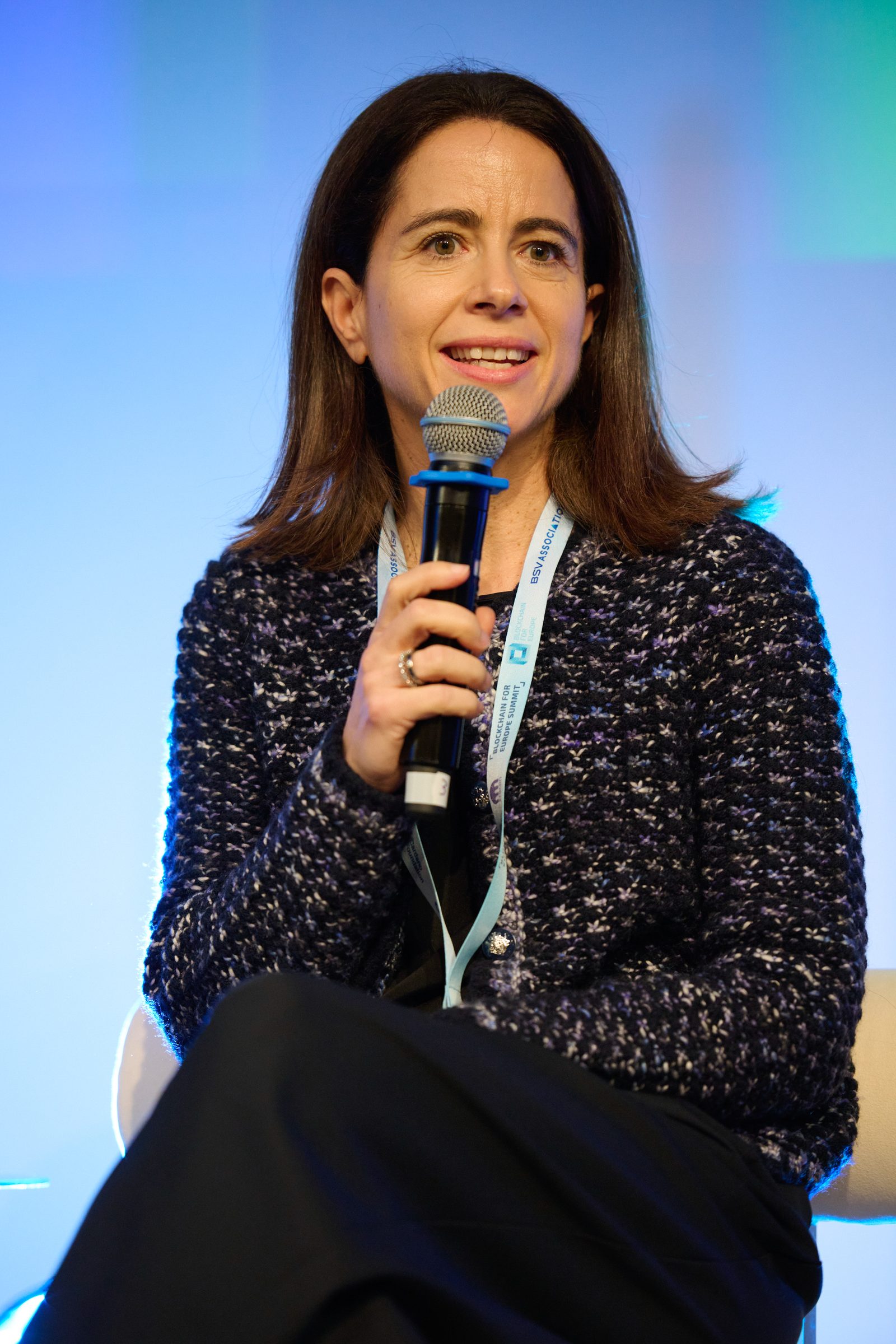 Speaker on stage at the Blockchain for Europe Summit, Brussels